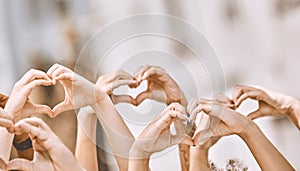 Heart sign, hands in air and peace for love, solidarity and have hope together for humanity. Community, hand gesture in