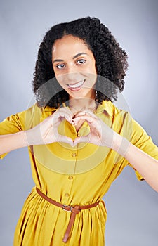 Heart, sign and happy woman for fashion portrait with thank you, support and hands emoji on a white background. Face