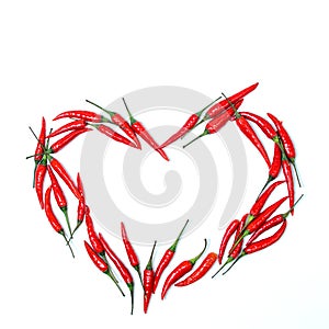 heart sign of red chili peppers on a white background. blank for designers.