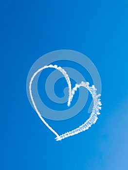 Heart skywriting in blue sky photo