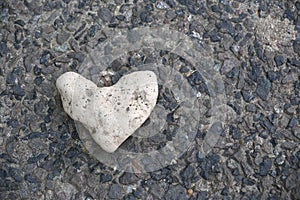 Heart of stone. Concept of toughness, no heart and no love. Heart-shaped marine stone. Fiend. cold blooded, disheartened