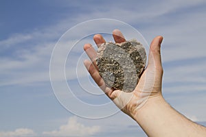 Heart of stone in man`s hands