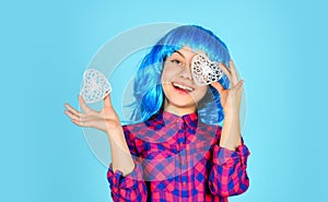 Heart is symbol of love. kid in romantic mood. child on party. small girl blue wig hold decorative heart. happy