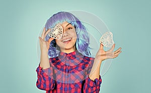 heart is symbol of love. kid in romantic mood. child on party. small girl blue wig hold decorative heart. happy