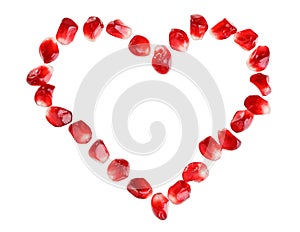 Heart symbol made from pomegranate seeds