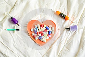 Heart, syringe, tablets. Cardiology icon