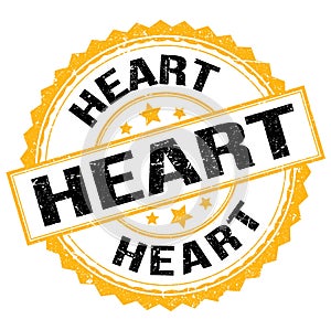 HEART text on yellow-black round stamp sign