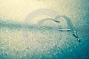 Heart water drop on light background