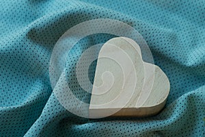 Heart wooden box on cloth fabric photo