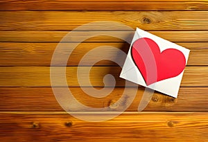 Heart on a wooden table. Valentines Day greeting card