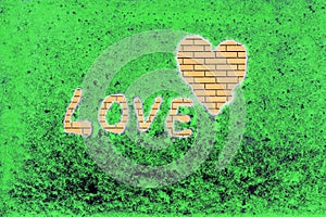 the heart and the word love on a green background