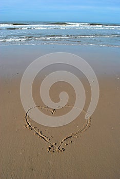 Heart written in sand at the beach