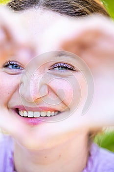 Heartfelt Connection: Beautiful Woman Embracing Love and Joy, portrait of a beautiful young woman looking through the