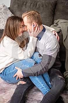 A heartfelt embrace between a man and woman, their foreheads touching, conveys deep connection and understanding