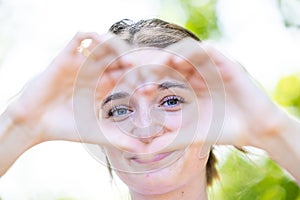 Heartfelt Gaze: Woman Framed by Loving Hands