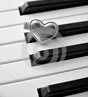 Hearth on piano keyboard music love concept passion art