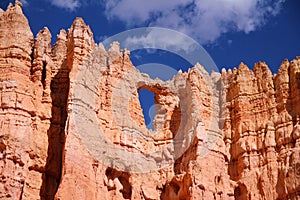A hearth shaped window in the red rock hoodoos of the Bryce Canyon National Park photo