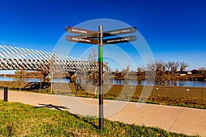 The Heartland of America Park Omaha Nebraska, directional signs and Farnam Pier on Missouri River.