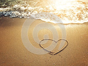 Hearts drawn on the sand of a beach