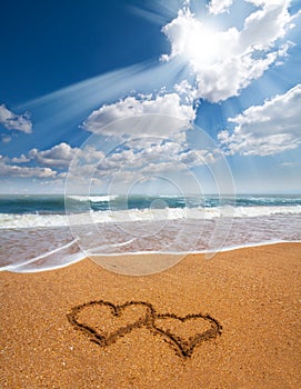 Hearts drawn on the sand of a beach