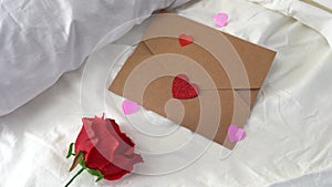 Hearts flying on wedding bed with letter and flowers, Valentine`s day