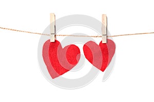 Hearts made of cloth on a rope with clothespins