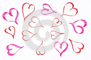 Hearts made from pink and red, satin ribbon on white background with clipping path, view from the top. Valentines Day concept.