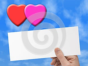 Hearts and postcard in hand