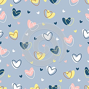 Hearts seamless pattern on a blue background. Vector valentine background. On the solid-colored hearts, the hearts