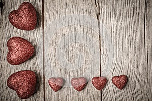 Hearts on Vintage Wood Background
