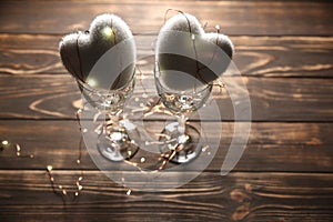 Hearts with wine glasses. Romantics love concept. Festive background. Valentines day postcard. Lights and lamps