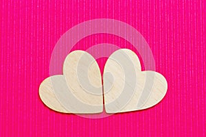 Hearts of wood on the pink corrugated background. Valentine& x27;s da