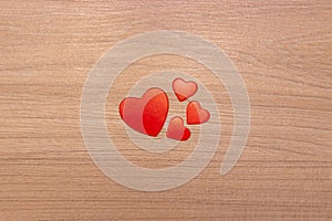 Hearts on a wooden background. Valentine's Day or Mother's Day greeting card.