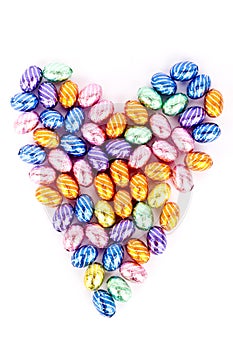 Heartshape made with chocolate eggs photo