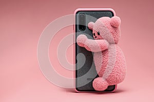 Heartwarming a pink bear hugging a brand new smartphone. The image captures the essence of gift-giving and the care we