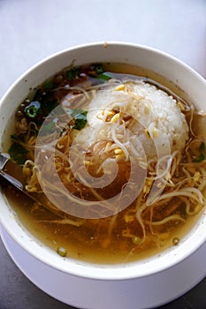 A hearty beef soup or Soto typically enjoyed for breakfast photo