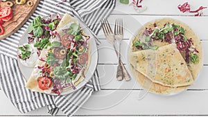 Hearty pancakes with fresh salad, tomato and radicchio