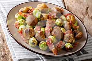 Hearty salad of chestnuts, Brussels sprouts and bacon close-up.