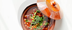 A hearty serving of baked beans in a ceramic dish, a healthy and nutritious meal