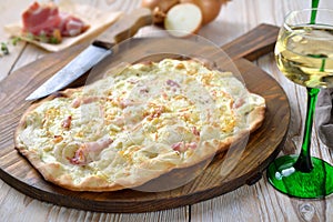 Hearty tarte flambÃ©e with with wine
