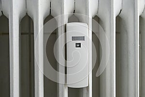 Heat cost allocator device attached to an older radiator to measure the energy consumption, copy space