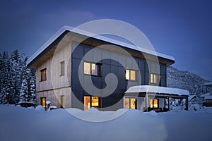 Heat energy self-sufficient single-family house in the snow-covered winter with solar thermal collectors photo