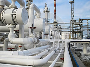 Heat exchangers in refineries. The equipment for oil refining. Heat exchanger for flammable liquids. The plant for the primary pro photo