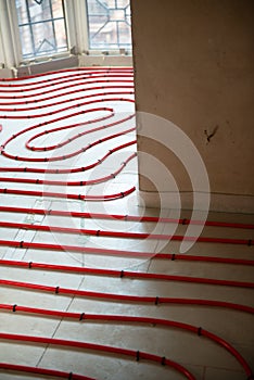 Heat floor instalation. Repair, engineering. Underfloor heating technology. Construction work, repair