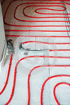 Heat floor instalation. Repair, engineering. Underfloor heating technology. Construction work, repair