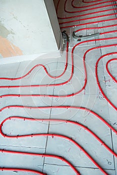 Heat floor instalation. Repair, engineering. Underfloor heating technology. Construction work, repair