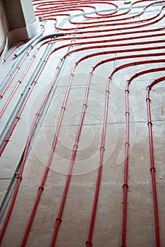 Heat floor instalation. Repair, engineering. Underfloor heating technology. Construction work, repair