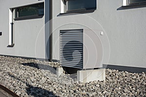 heat pump in a new building area with modern house facades