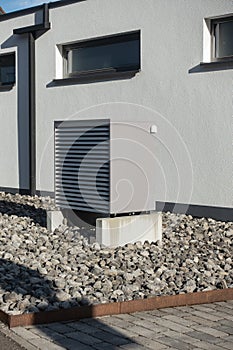 heat pump in a new building area with modern house facades