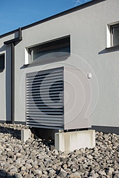 heat pump in a new building area with modern house facades